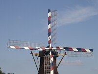 Historic windmill Sint Victor, Zeeland, North Brabant, Netherlands  Historic windmill Sint Victor, Zeeland, North Brabant, Netherlands : windmill, Netherlands, Dutch, europe, european, building, architecture, monument, historic, history, culture, dutch culture, travel destination, destination, 4, four, wings, rural, landscape, rural landscape, outside, outdoor, outdoors, no people, nobody, season, summer, summertime, sky, blue sky, grass, Sint Victor, Zeeland, North Brabant, colorful, red, white, blue