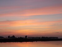 Sunset over lake in Dutch province Friesland  Sunset over lake in Dutch province Friesland : sunset, evening, dusk, twilight, setting sun, red, warm, sky, skyscape, cloud, clouds, cloudscape, reflection, reflected, mirror, mirrored, outside, outdoor, landscape, rural landscape, countryside, rural scene, non-urban scene, lake, water, land, Friesland, Frylan, Dutch, Holland, Netherlands, Europe, European, no people, nobody, summer, summertime, spring, springtime, romantic