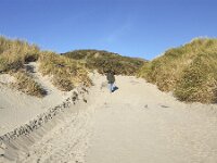 NL, Zeeland, Schouwen-Duiveland, Westenschouwen 30, Saxifraga-Roel Meijer   Burgh-Haamstede, Zeeland, Netherlands : Dutch, elderly woman, Europe, european, holland, mature woman, natural, nature, netherlands, non-urban scene, outdoor, outdoors, outside, rural, rural landscape, rural scene, summer, summertime, woman, beach, coast, dunes, sand, sandy, Schouwen-Duiveland, seaside, Zeeland, blue sky, Burgh-Haamstede, uphill